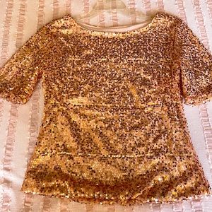 Rose Gold sequined top.